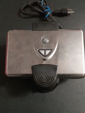Vintage GE Waffle Baker WB03 Model 169186 with a silver chrome finish and black
